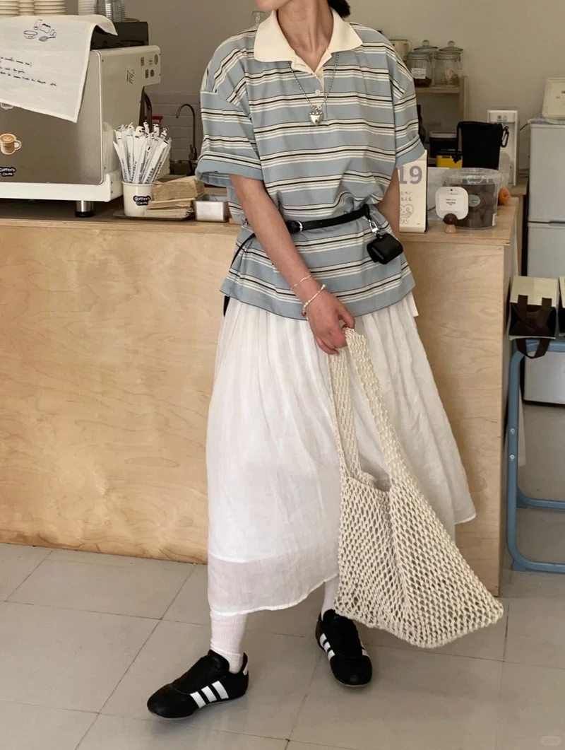 Outfit nổi bật nhờ áo polo form rộng chụp outfit