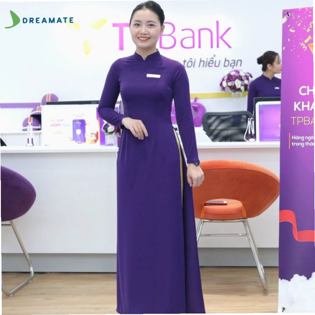 Áo dài đồng phục màu xanh lá cây với cổ tim và tay phồng