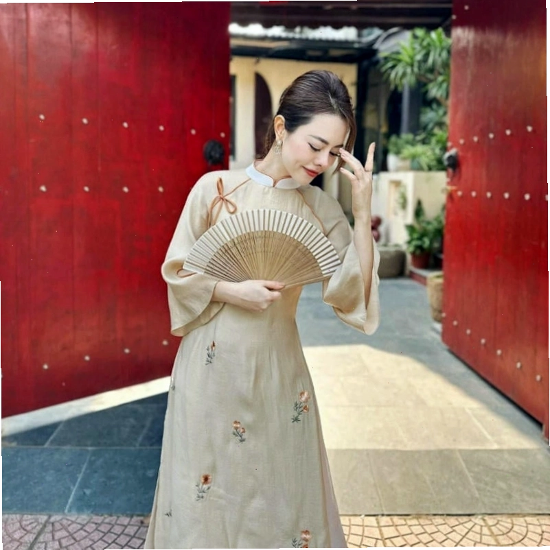 Áo dài tay loe màu xanh ngọc bích thắt nơ eo