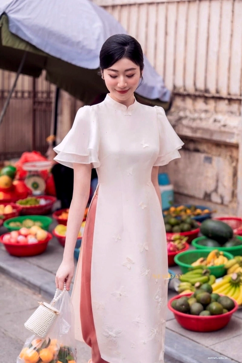 Áo dài tay loe phối bèo nhún màu xanh lam dịu mát