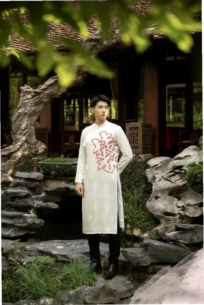 Áo dài tết nam 2026 tay raglan, cổ trụ, chất liệu gấm màu xanh navy