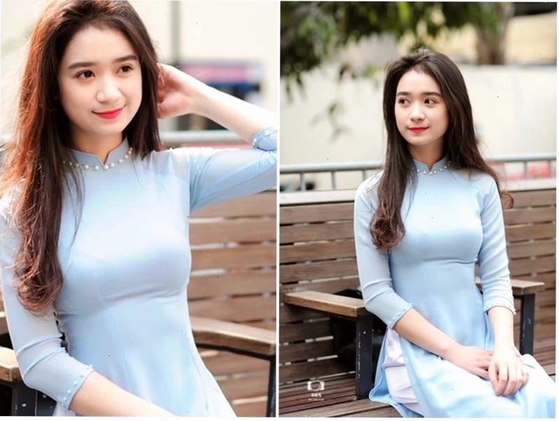 Áo dài trắng với đường viền cổ và tay áo màu xanh