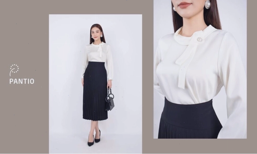 Áo kiểu nữ cổ buộc nơ từ chất liệu lụa màu trắng, tạo vẻ dịu dàng, nữ tính