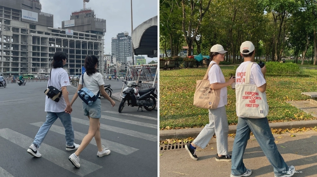 Cặp đôi đeo túi đôi canvas, tạo dáng trước một bức tường graffiti