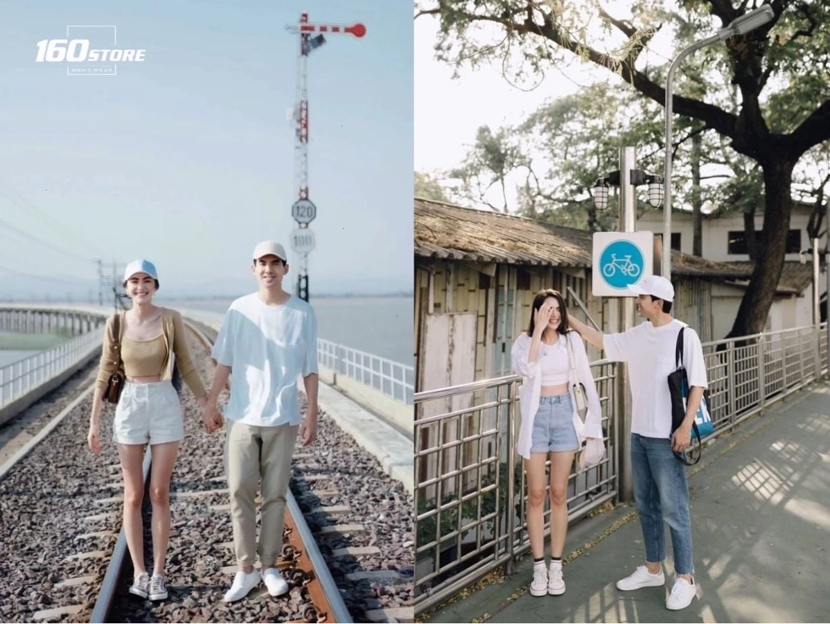 Cặp đôi diện áo croptop và quần short năng động, tạo dáng nhí nhảnh trước một bức tường graffiti