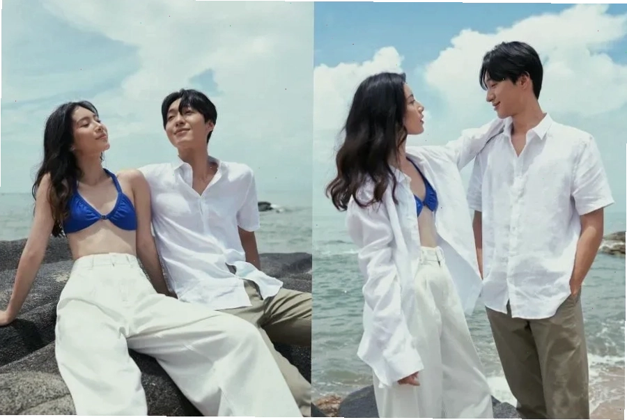 Cặp đôi mặc set đồ đôi thể thao màu xám, cả hai đang nắm tay nhau và nhìn về phía xa