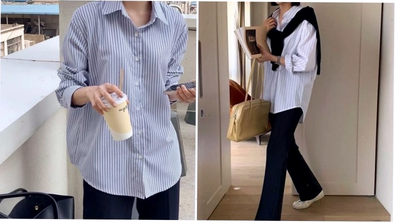 Cô gái diện áo sơ mi oversize màu xanh nhạt, quần jean xanh và túi tote