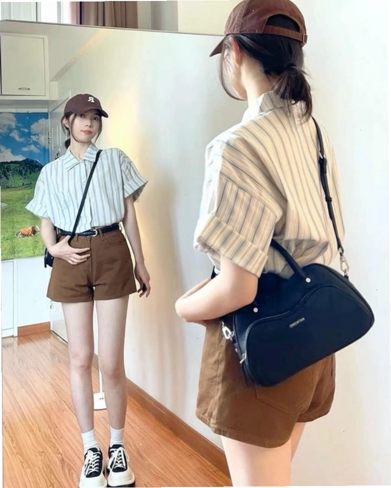 Cô gái diện áo sơ mi tay ngắn form rộng màu be phối cùng quần short kaki