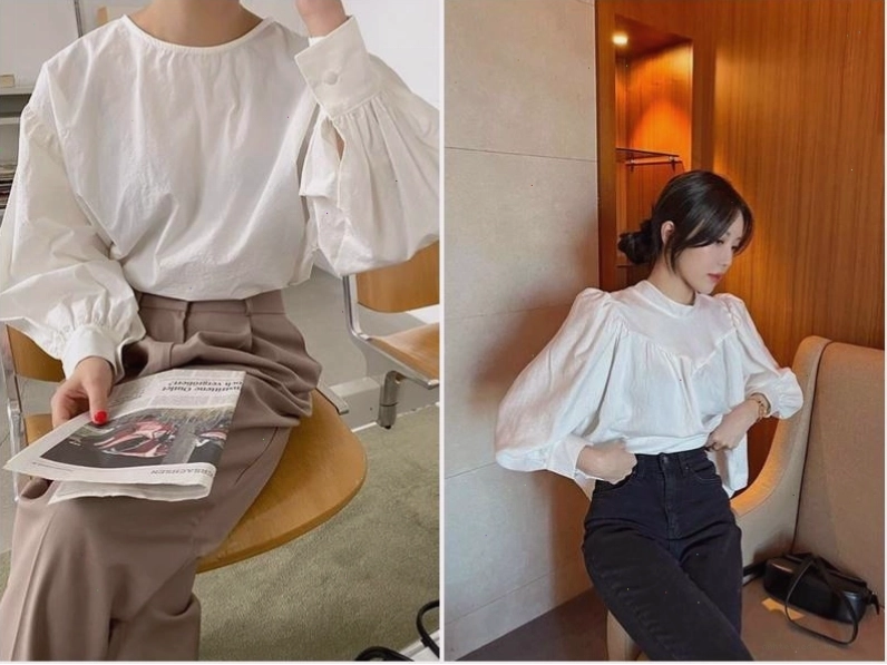 Cô gái diện áo sơ mi trắng oversized khoác ngoài áo hai dây, kết hợp quần short jean và giày sneakers