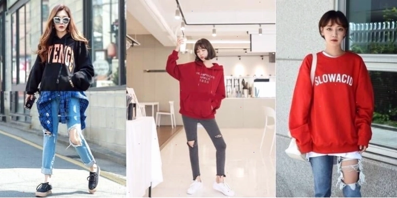 Cô gái mặc quần jean rách và áo hoodie