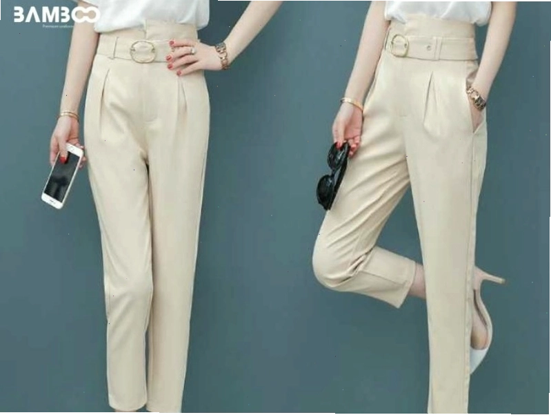 Cô gái mặc quần tây nữ công sở lưng cao màu đen phối áo sơ mi trắng có chi tiết thắt nơ