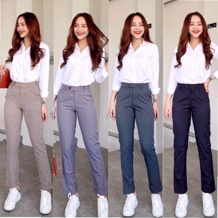 Cô gái mặc quần vải lưng cao màu đen ống đứng phối cùng áo sơ mi oversize xanh pastel
