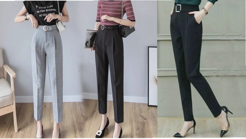 Cô gái mặc quần vải lưng cao màu xám phối cùng áo len mỏng và giày loafer
