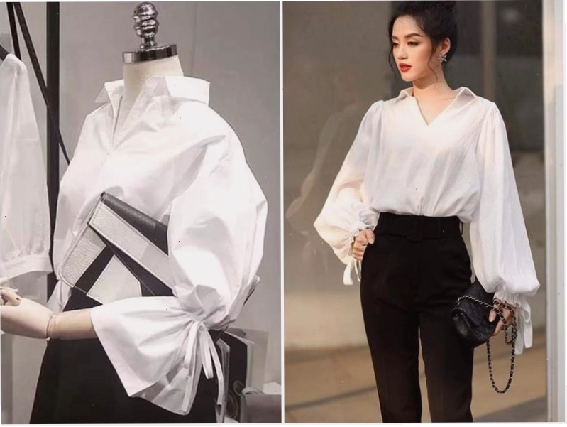 Cô gái trẻ trung diện áo sơ mi trắng tay phồng, quần jeans xanh ống đứng, phụ kiện túi xách trắng