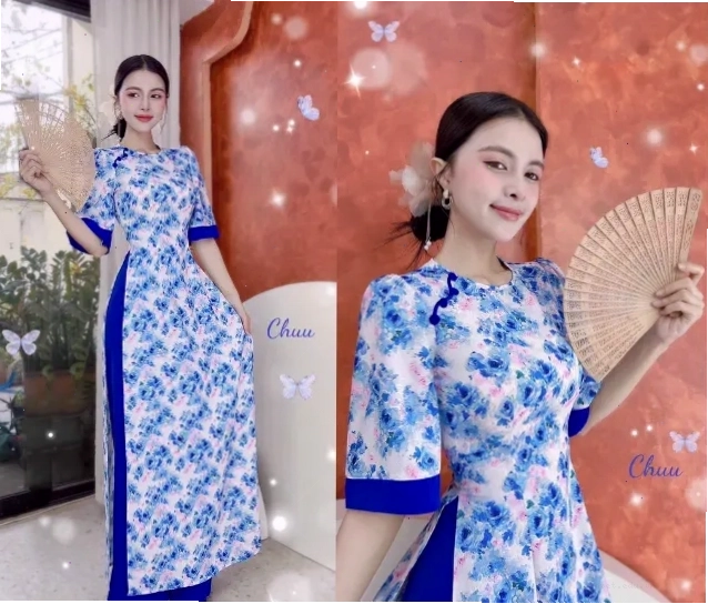 Người mẫu diện áo dài truyền thống với cổ tròn và tay lỡ màu xanh ngọc
