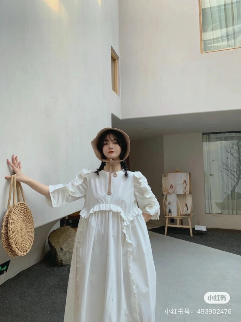 Váy babydoll tay phồng dáng dài màu nâu socola, cổ tròn, chất liệu vải mềm mại