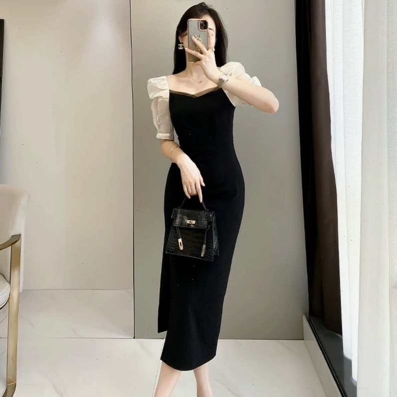 Váy xẻ tà cao cấp OE885 màu đen ôm sát, chất liệu co giãn tốt, tôn lên đường cong cơ thể.